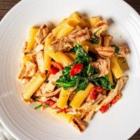 Rigatoni Montanara · Fresh sautéed spinach, sun-dried tomatoes, and diced grilled chicken in a light garlic and v...