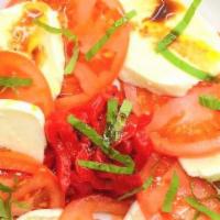 Caprese Salad · Mozzarella, tomatoes, basil, roasted peppers, and balsamic vinegar.