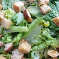 Caesar Salad · Romaine lettuce, shaved Parmesan cheese and croutons.