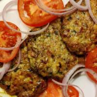 Chicken Chapli Kebab (2 Pieces) · Mughlai-influenced Pashtun-style minced kebab induced with selected spices in the shape of p...