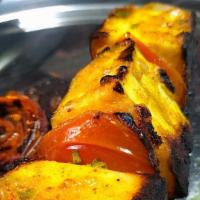 Paneer Tikka · Homemade cottage cheese marinated with yogurt, aromatic herbs and spices, skewered and finis...