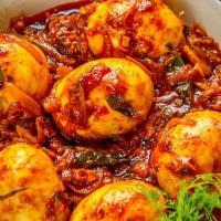 Egg Curry · Carefully selected boiled eggs cooked in onion-tomato based curry made of ginger, garlic and...