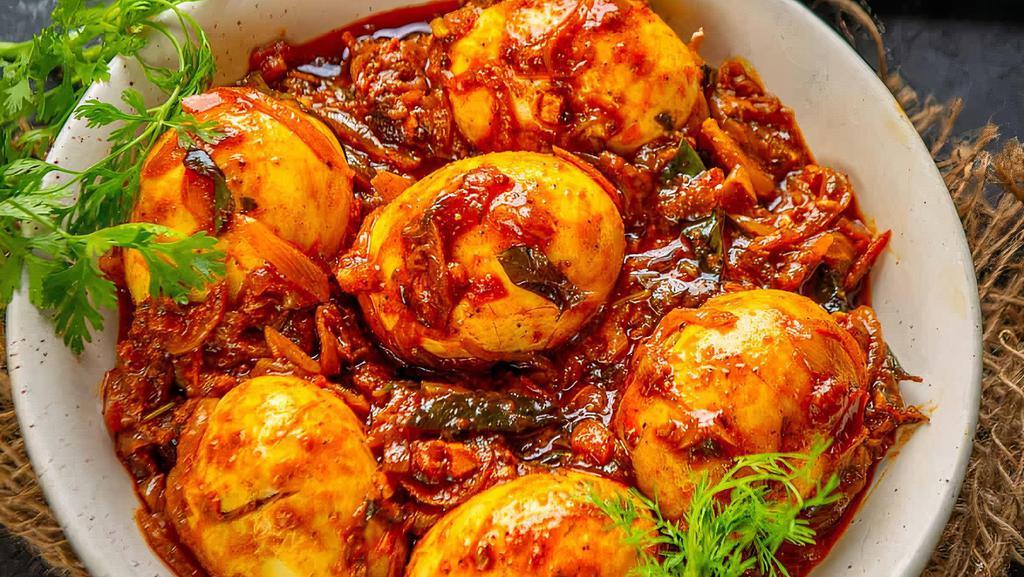 Egg Curry · Carefully selected boiled eggs cooked in onion-tomato based curry made of ginger, garlic and red chilies.