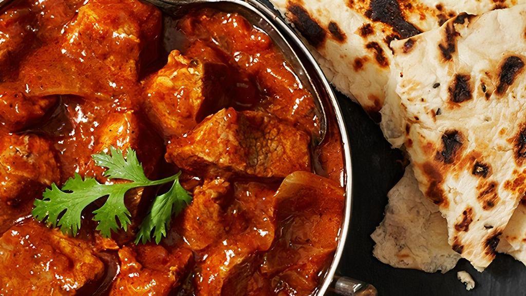 Lamb Rogan Josh · Tender pieces cooked in old Kashmiri style flavored with cardamoms, Kashmiri chilies, cloves and cinnamon.
