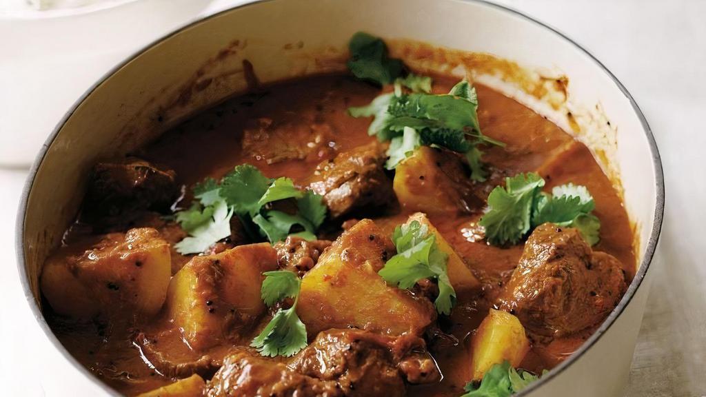 Lamb Vindaloo Kashmiri · Goan spicy delicacy prepared with crushed peppers and dry Kashmiri chilies and cooked with wine-vinegar.