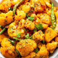 Aloo Gobi Masala · Freshly cut cauliflower, tomatoes and potatoes cooked to perfection with exotic Indian spice...