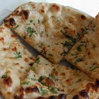 Chicken Keema Naan · Leavened white flour bread with minced marinated ground chicken and spices, perfected in tan...