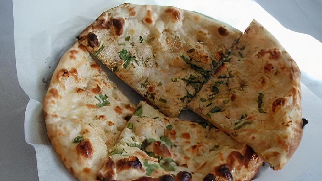Chicken Keema Naan · Leavened white flour bread with minced marinated ground chicken and spices, perfected in tandoor clay oven.