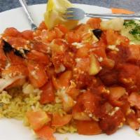 Shrimp Santorini · Jumbo shrimp, feta cheese, tomato, garlic and red wine sauce.