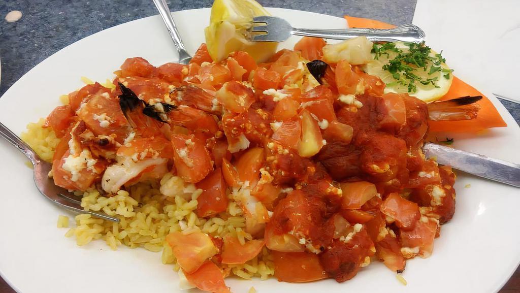 Shrimp Santorini · Jumbo shrimp, feta cheese, tomato, garlic and red wine sauce.