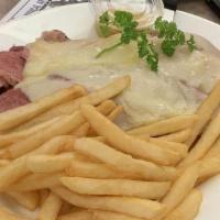 Reuben · Corned beef and grilled swiss cheese With sauerkraut, pickle, cole slaw and potato salad.