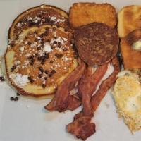 The Hungry Man  · 2 Pancakes , Sausage , Hashbrown , Bacon , 2 Eggs ,  Toast.