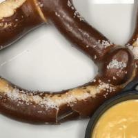 Jumbo Pretzel · Jumbo pretzel served with a beer cheese sauce and spicy brown mustard.