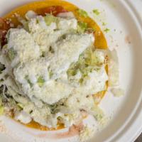 Tostada (Choice Of 1 Meat) · Fried corn tortilla, refried beans, lettuce, tomatoes, onions, sour cream, cotija cheese, an...