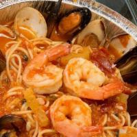 Seafood Combination · Shrimp, mussels, calamari, and clams over pasta.