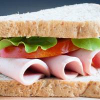 Bologna Sandwich · Delicious and fresh bologna served with lettuce, tomato, and mayo.