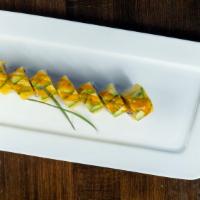 Spicy Mama Roll · Spicy crunchy shrimp, crab with mango, avocado on top and mango sauce.