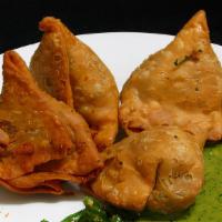 Samosa  · Crispy pastry filled with mixed vegetables.