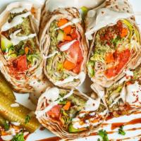 Falafel Sandwich · Baked falafel, lettuce, tomato, pickles, tahini sauce. Vegetarian, vegan upon request.