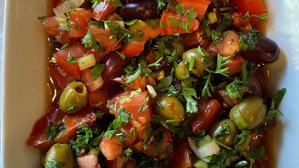 Olive Salad · Black and green olives, parsley, tomato, onion, pomegranate syrup.
