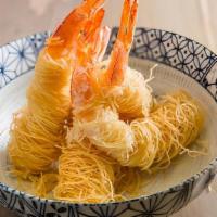 Shrimp Kataifi · Four pieces. Deep-fried jumbo shrimp wrapped with kataifi.