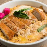 Katsu Donburi · Pork cutlet and vegetable, cooked in egg sauce served on rice.