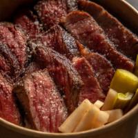 Butcher'S Bowl · An ever-rotating chef's selection of three USDA prime cuts over rice and housemade pickles, ...