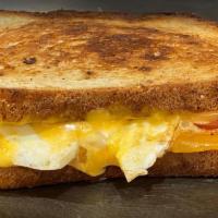 Fried Egg Grilled Cheese · 2 fried eggs, bacon, cheese (choice), tomato on choice of bread.