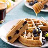 Homestyle Waffles With Blueberries · Hot & Tasty Homestyle waffles, served hot off the griddle. Topped with fresh blueberries, bu...