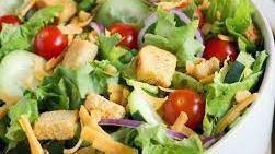 House Salad · Tossed garden salad topped with cucumbers, tomatoes and mozzarella cheese, served with our f...