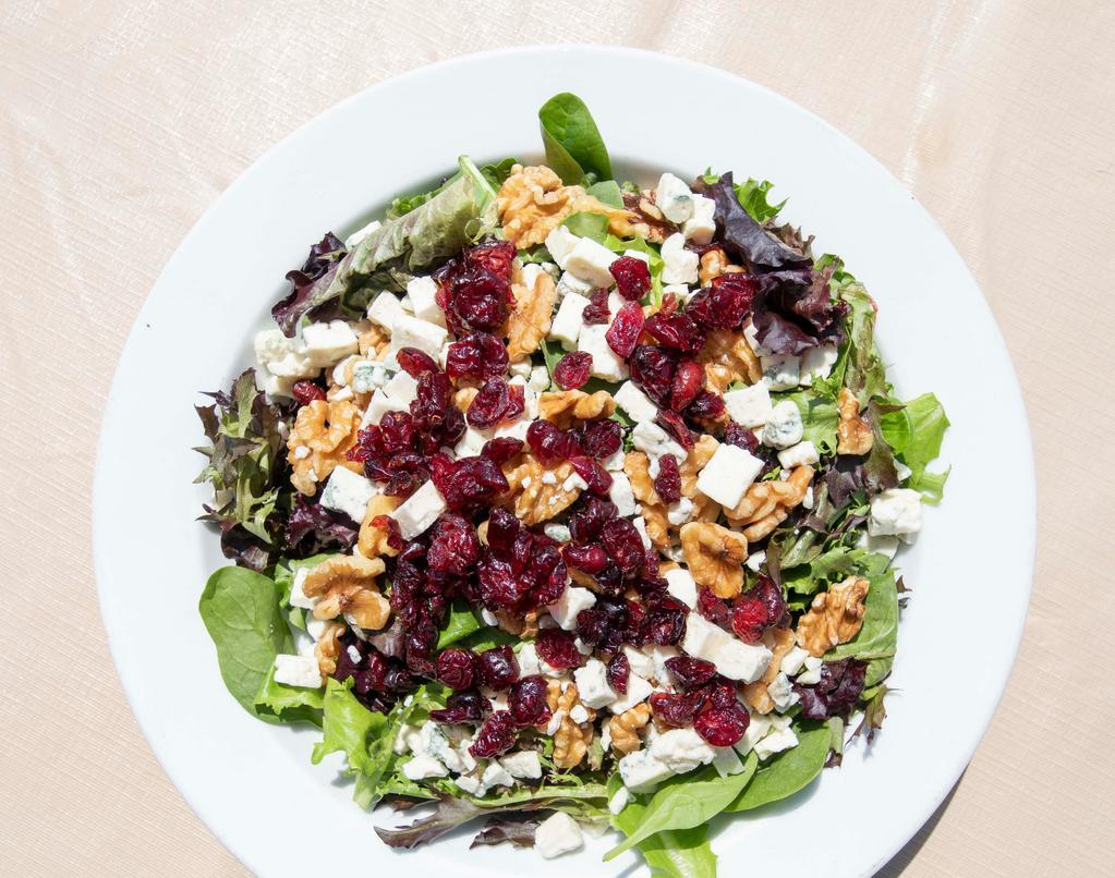 Sunshine Salad · Mesclun greens, walnuts, and cranberries with imported gorgonzola cheese in a balsamic vinaigrette dressing.