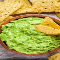 Chips & Guacamole · Crispy warm corn tortilla chips with a side of fresh house-made guacamole.