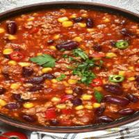 Chili Con Carne Bowl · Mildly spiced beef stew prepared with fresh tomatoes and hearty beans then topped with chopp...