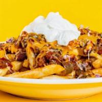 The Chili Fries · wagyu beef and beans chili, shredded cheese, diced red onions, and side of crema