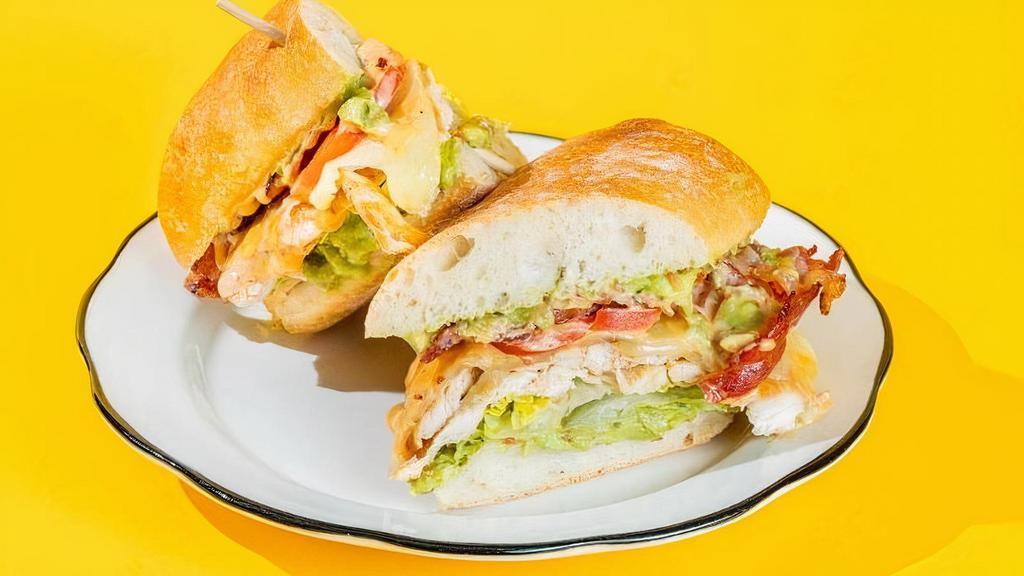 The Clubhouse · avocado mash, chicken breast, cheddar cheese, tomatoes, romaine lettuce, applewood smoked bacon, honey-chipotle mayo, ciabatta hero