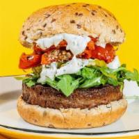 The Republic Veggie Burger · beyond plant-based burger, marinated roasted tomatoes, pickles, baby arugula, herbed vegan m...