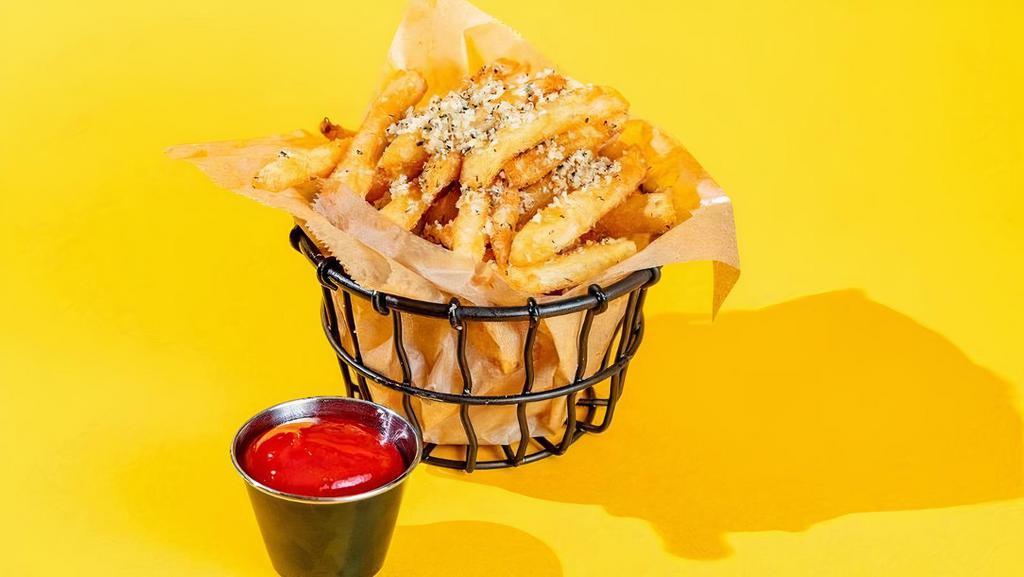 Truffle Fries · battered fries tossed in grated parmesan, truffle oil, tuscan herbs. served with side of ketchup.