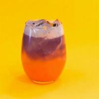 Purple Sunset · pea blossom infused coconut rum, pineapple juice, orange juice, dash of grenadine