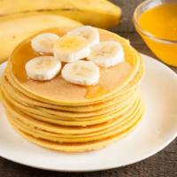 Banana Pancakes · Fluffy, golden, buttery buttermilk pancakes loaded with fresh bananas. Served with real butt...