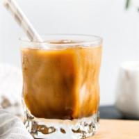 Iced Latte · Rich, dark espresso with cold milk over ice.