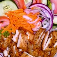 Fried Chicken Over Tossed Salad
 · Halal. Served with pita bread and dressing.