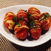 Takoyaki · Savory round octopus pancakes with sweet and savory sauce alongside Japanese mustard sauce w...
