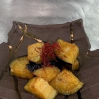Stir-Fried Eggplant · Vegan. Sliced eggplant brushed with Japanese style sweet savory garlic mirin glaze.