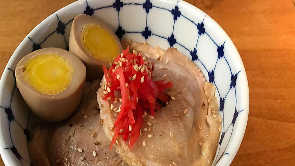 Chashu Mini Bowl · Marinated pork belly, boiled egg, pickled ginger, green onions, spinach, sesame seed on rice.