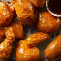 Soy Garlic Wings · Served in a savory sauce with a mild tang of garlic.