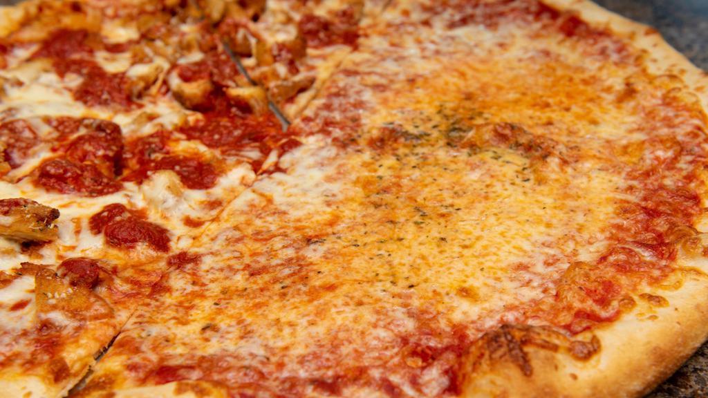 Fresh Mozzarella Pizza · Filetto sauce, fresh mozzarella, basil leaf, and slices of tomato or roasted peppers.