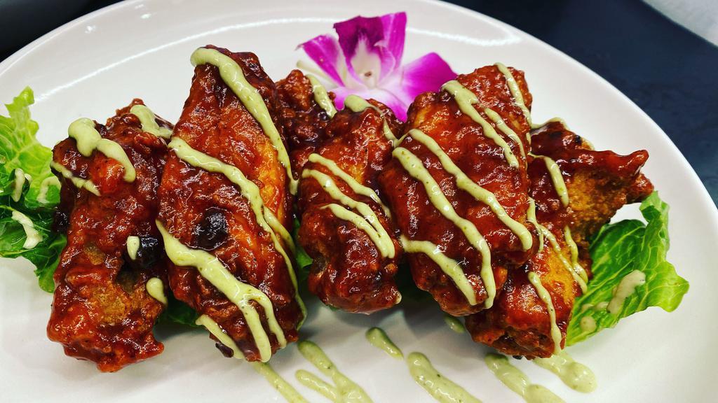Sweet Chili Wings · Crispy wings in our signature sweet chili sauce