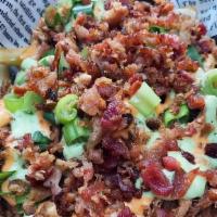 Pulled Pork Loaded Fries · Cajun Fries topped with Cajun Pulled Pork, Caramelized Onions, Bacon Crumbles, Scallions and...