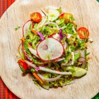 Mexican Street Salad · Romaine lettuce, carrots, cabbage, cucumbers, radish, onion & tomatoes tossed with lime vina...