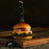 Chef'S Truffle Burger · Black Angus ground beef burger on a brioche bun topped with cheddar, lettuce, tomatoes, whit...